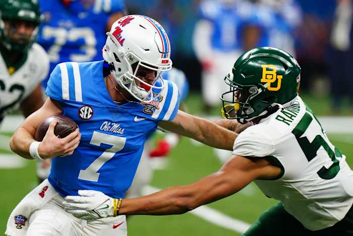 Jan 1, 2022; New Orleans, LA, USA; Mississippi Rebels quarterback Luke Altmyer (7) runs with the ball against Baylor Bears linebacker Garmon Randolph (55) during the first half in the 2022 Sugar Bowl at Caesars Superdome. Mandatory Credit: John David Mercer-USA TODAY Sports
